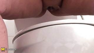 Mother pissing and get pee on her big tits 